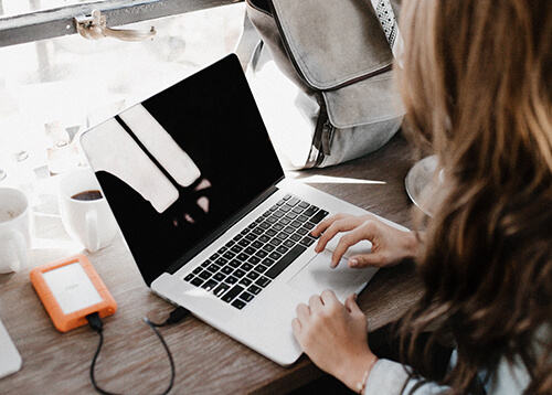 Customer using her laptop for online banking