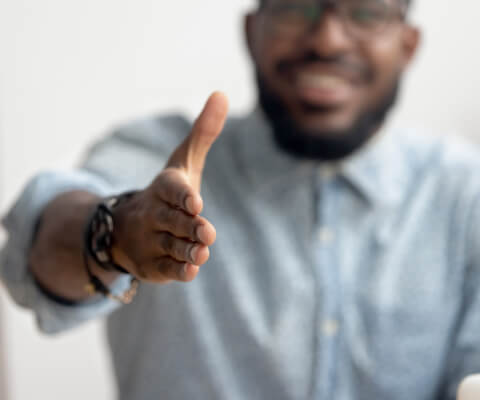 man extending his hand for a handshake